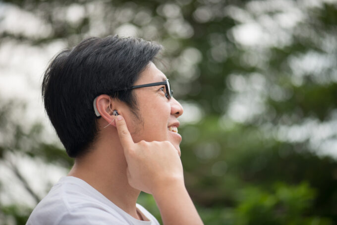man with hearing aid behind the ear